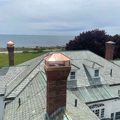 Frechette Chimney - Chimney Repair Frechette Chimney - After Chimney Repair was completed on masonry brick chimney and copper chimney caps were installed