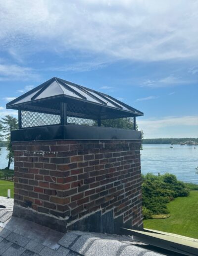 New chimney cap installed on a masonry chimney in Portland, ME.